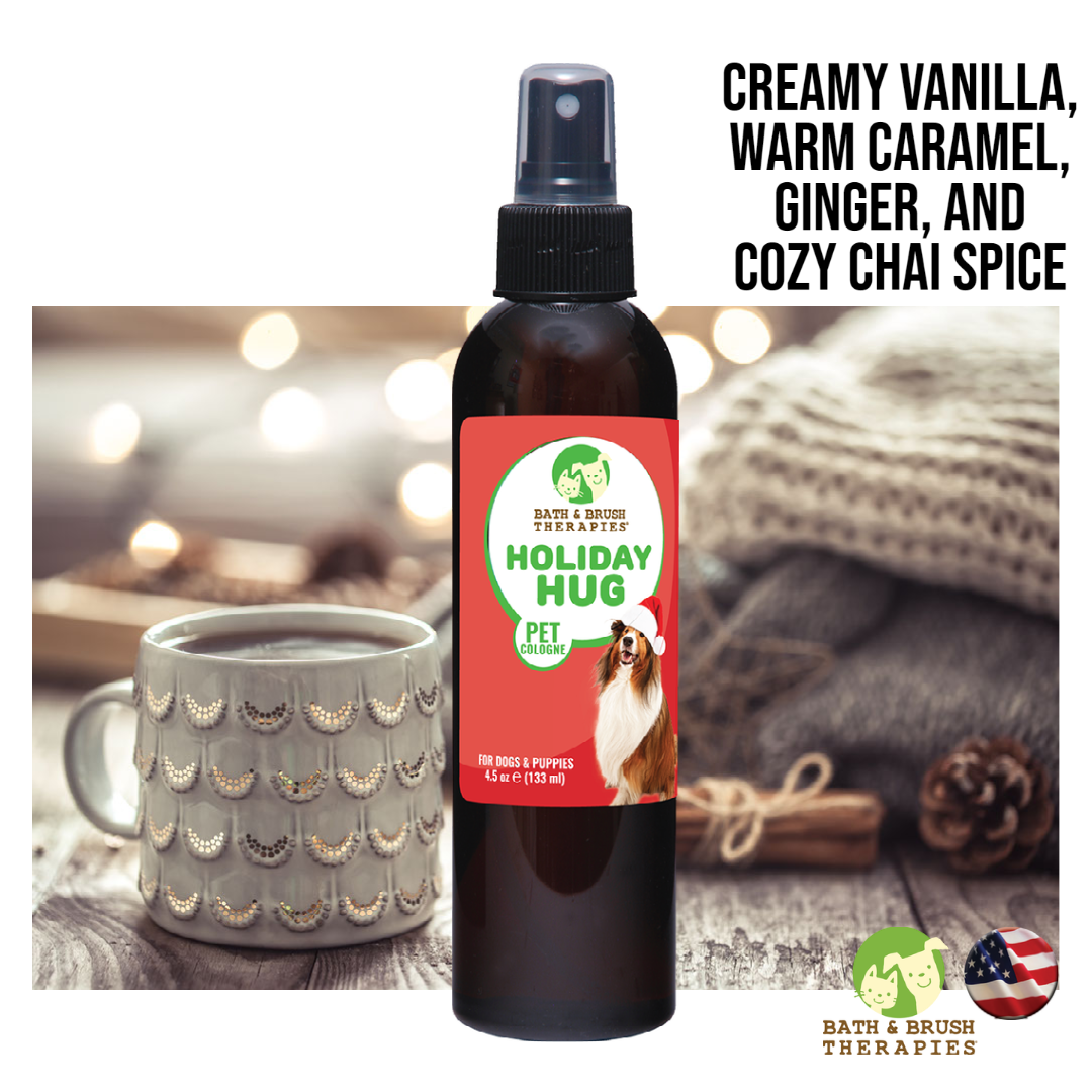 Holiday Hug Pet cologne placed over image of mug and blankets. 