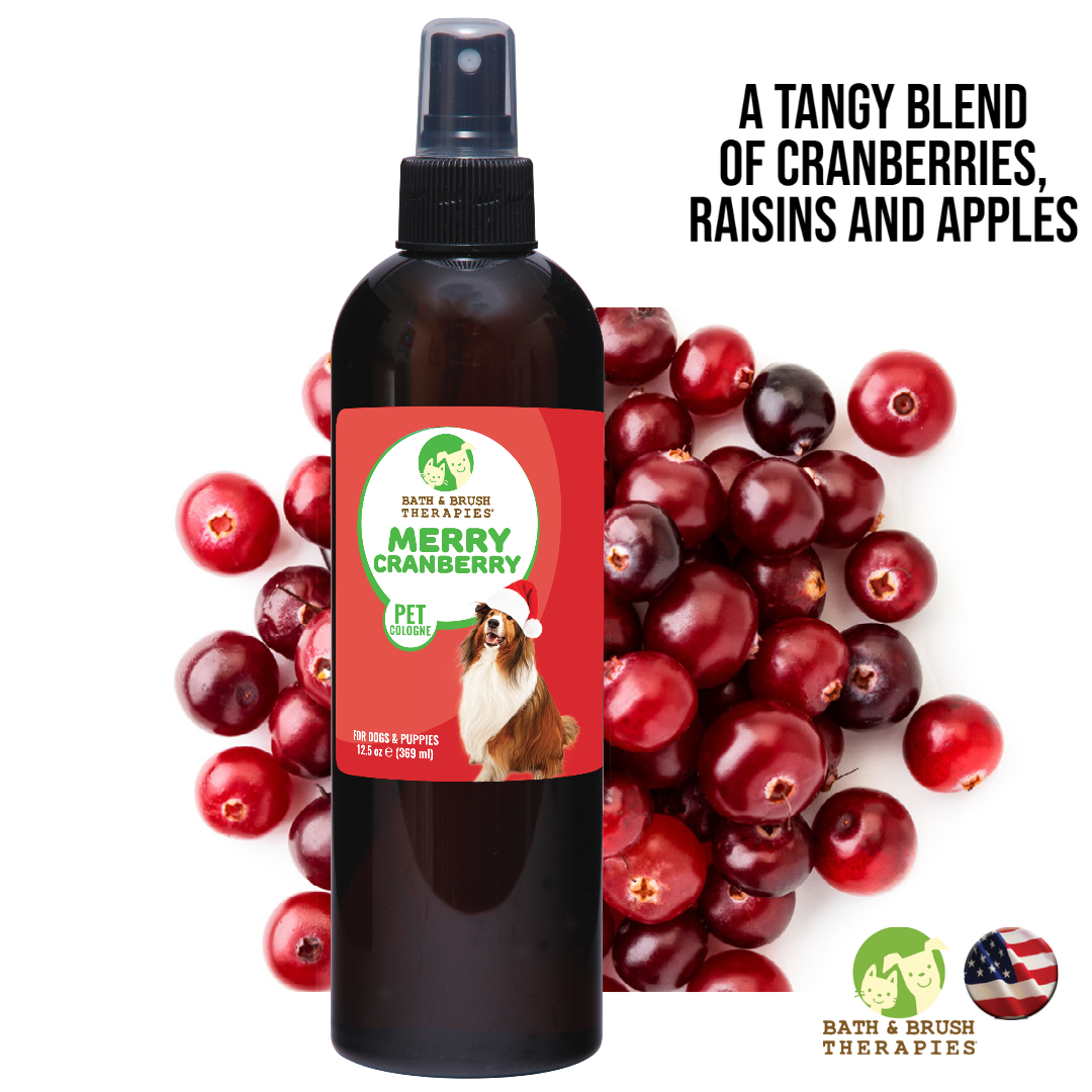 Merry Cranberry Pet Cologne in 12.5 ounce pump spray bottle over an image of cranberries. Talks about tangy blend of cranberries, raisins, and apples. 